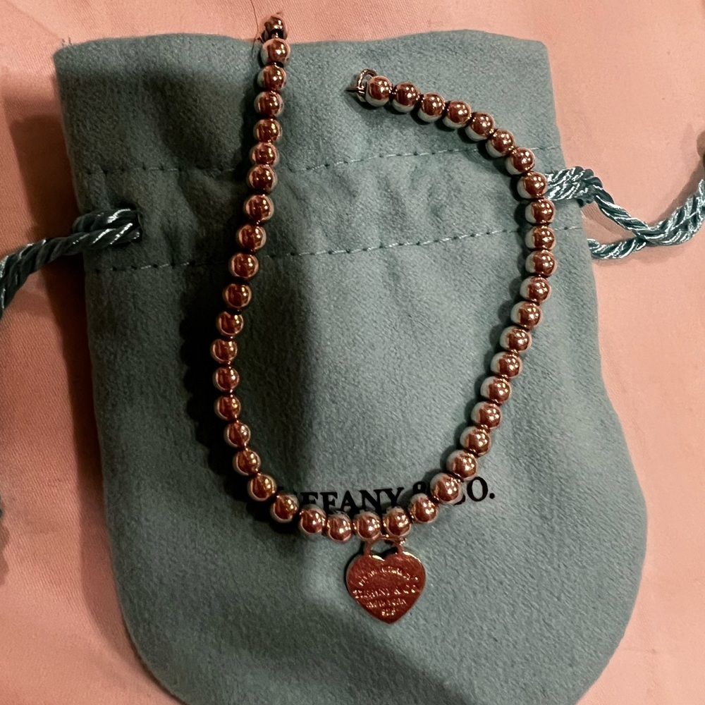 Authentic Tiffany and Co silver beaded bracelet with heart charm, size small